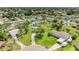 Property on a spacious lot featuring mature trees, lush landscaping, and a charming neighborhood at 237 Saxon Cir, Venice, FL 34293