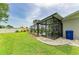 The fenced backyard features a screened-in pool area with ample green space at 237 Saxon Cir, Venice, FL 34293