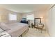 Serene bedroom featuring a cozy bed, natural light, and stylish decor at 237 Saxon Cir, Venice, FL 34293