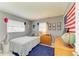 Neutral bedroom with gray walls, wooden dresser, and blue carpet at 237 Saxon Cir, Venice, FL 34293