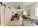 Bonus room with desk area, daybed, and access to backyard at 237 Saxon Cir, Venice, FL 34293