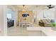 Bright dining area with seating for four, adjacent to a stylish, open living space at 237 Saxon Cir, Venice, FL 34293