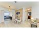 Charming dining area with a granite-topped table and seating for four at 237 Saxon Cir, Venice, FL 34293