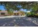The Venice Art Center is set back from a wide driveway lined with lush, tropical vegetation and elegant architecture at 237 Saxon Cir, Venice, FL 34293