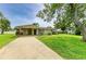 Charming single-story home with well-maintained lawn and concrete driveway at 237 Saxon Cir, Venice, FL 34293