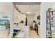 Well-lit, all-white kitchen featuring stainless steel appliances and modern finishes at 237 Saxon Cir, Venice, FL 34293