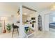 Modern kitchen with breakfast bar and seamless transition to living spaces at 237 Saxon Cir, Venice, FL 34293