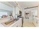 Bright kitchen overlooking the dining area, featuring modern appliances and finishes at 237 Saxon Cir, Venice, FL 34293