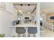 Eat-in kitchen featuring a breakfast bar with pendant lights and a modern design at 237 Saxon Cir, Venice, FL 34293