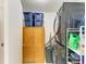 Laundry room with stackable washer/dryer and storage at 237 Saxon Cir, Venice, FL 34293