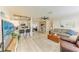 Open concept living room with breakfast bar connecting the kitchen and living area at 237 Saxon Cir, Venice, FL 34293