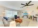 Inviting living room with natural light, modern furniture, and seamless layout at 237 Saxon Cir, Venice, FL 34293