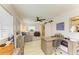 Living room with desk and chair, sliding barn door, and sitting area at 237 Saxon Cir, Venice, FL 34293