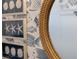 Nautical themed bathroom features fish wallpaper, framed art, and a stylish rope mirror at 2586 Wild Cherry Path, Sarasota, FL 34240
