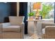 Cozy sitting area, lit table lamp, and an outside view at 2586 Wild Cherry Path, Sarasota, FL 34240