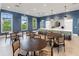 Beautifully designed dining area featuring large windows, and a breakfast bar with bar stool seating at 2586 Wild Cherry Path, Sarasota, FL 34240