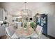 Open floor plan with dining area that flows seamlessly to the kitchen and living area at 2586 Wild Cherry Path, Sarasota, FL 34240