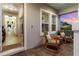 Welcoming home entrance with tile flooring, views from the covered porch, and a view down the hall at 2586 Wild Cherry Path, Sarasota, FL 34240