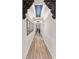 Bright hallway featuring wood floors, recessed lighting, and decorative ceiling feature at 2586 Wild Cherry Path, Sarasota, FL 34240