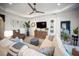 Comfortable living room featuring plush seating, stylish decor, and plenty of natural light at 2586 Wild Cherry Path, Sarasota, FL 34240
