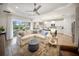 Open floor plan with a spacious living room area leading to the backyard and modern kitchen at 2586 Wild Cherry Path, Sarasota, FL 34240