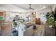 Bright open-concept living area featuring hardwood floors and seamlessly flowing into the modern kitchen at 2586 Wild Cherry Path, Sarasota, FL 34240