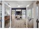 Bright home office with built-in bookcases, desk, and a ceiling fan at 2586 Wild Cherry Path, Sarasota, FL 34240