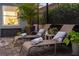 Relaxing screened-in patio with comfortable sun loungers and lush landscaping at 2586 Wild Cherry Path, Sarasota, FL 34240