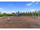 Community playground with slides, swings, and ample space for children to run and play at 2586 Wild Cherry Path, Sarasota, FL 34240