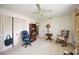 Functional bedroom includes two closets, a bookcase, and a relaxing rocking chair at 307 Rubens Dr, Nokomis, FL 34275