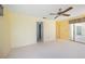 Bedroom with light-colored walls and carpeting, a ceiling fan and sliding glass doors at 307 Rubens Dr, Nokomis, FL 34275