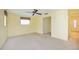 Bedroom featuring light-colored walls and carpeting, a ceiling fan, and a window at 307 Rubens Dr, Nokomis, FL 34275
