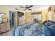 Spacious bedroom features access to the lanai with a comfortable bed and dresser at 307 Rubens Dr, Nokomis, FL 34275