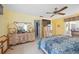 Well-lit bedroom with multiple dressers, mirrors, and access to the bathroom at 307 Rubens Dr, Nokomis, FL 34275