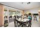 Dining area that flows into a screened patio with views of the backyard at 307 Rubens Dr, Nokomis, FL 34275