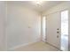 Bright entryway features a neutral color palette and ample natural light from the front door windows at 307 Rubens Dr, Nokomis, FL 34275