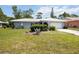 Charming single-story home with well-maintained lawn and mature landscaping at 307 Rubens Dr, Nokomis, FL 34275