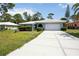 Charming single-story home with well-maintained lawn and mature landscaping at 307 Rubens Dr, Nokomis, FL 34275