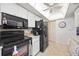 A clean and organized kitchen with essential appliances, neutral decor, and ample storage at 307 Rubens Dr, Nokomis, FL 34275