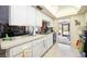 Well-lit kitchen with plenty of counter space and modern fixtures, great for cooking at 307 Rubens Dr, Nokomis, FL 34275