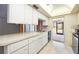Kitchen with ample countertop space and a view of the screened patio and backyard at 307 Rubens Dr, Nokomis, FL 34275