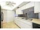 Bright kitchen featuring white cabinets, stainless steel appliances, and a skylight at 307 Rubens Dr, Nokomis, FL 34275