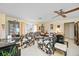 Large living room with plush seating, bay windows, and stylish decor at 307 Rubens Dr, Nokomis, FL 34275