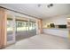 Open-concept living area with access to the kitchen and screened patio, great for entertaining at 307 Rubens Dr, Nokomis, FL 34275