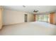 Bright living room with ceiling fan, sliding glass doors and ample space for furniture at 307 Rubens Dr, Nokomis, FL 34275