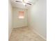 Small empty room with a neutral color palette and a single window with blinds at 307 Rubens Dr, Nokomis, FL 34275