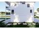 Stylish home featuring uniform windows, a waterfront view, and stepping stone sidewalk at 312 Avenida Leona, Sarasota, FL 34242