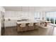 Bright, spacious kitchen with marble countertops, stainless steel appliances, and a modern island at 312 Avenida Leona, Sarasota, FL 34242