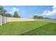 Spacious and well-kept backyard featuring a lush lawn and privacy fence, great for relaxation and entertainment at 3813 Willow Branch Pl, Palmetto, FL 34221