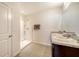 Bathroom featuring double sinks, granite counters, and a glass-enclosed shower at 3813 Willow Branch Pl, Palmetto, FL 34221